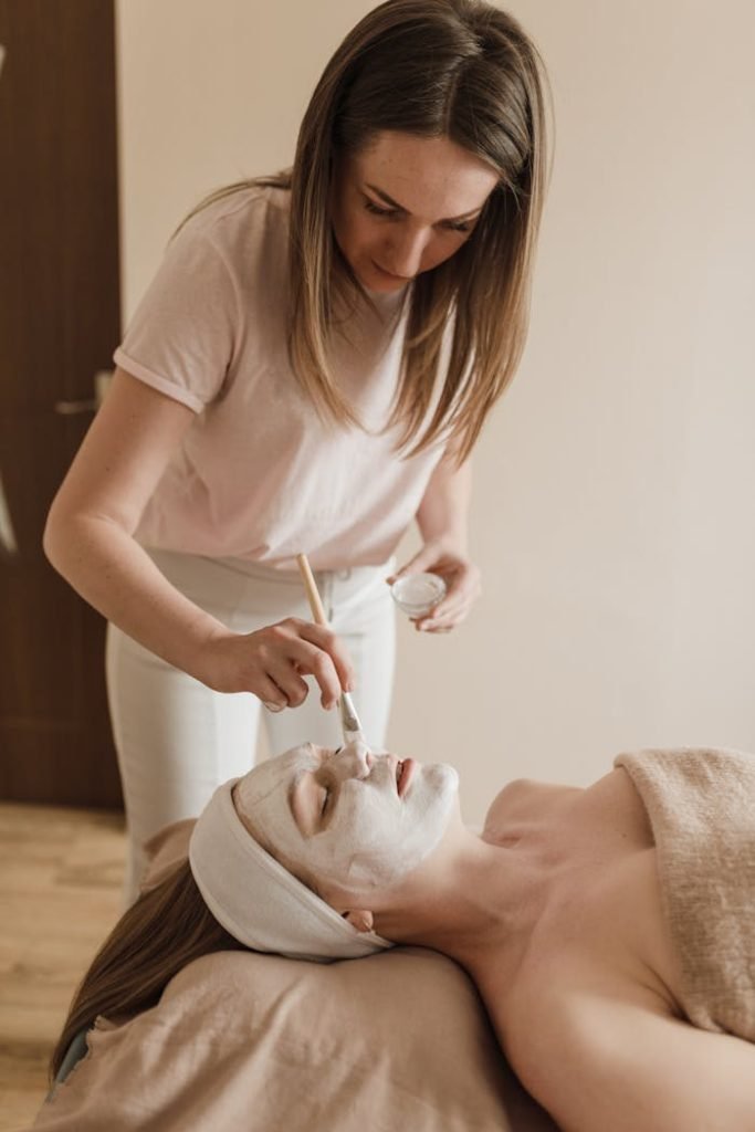 Woman receiving a facial treatment at a spa for ultimate relaxation.